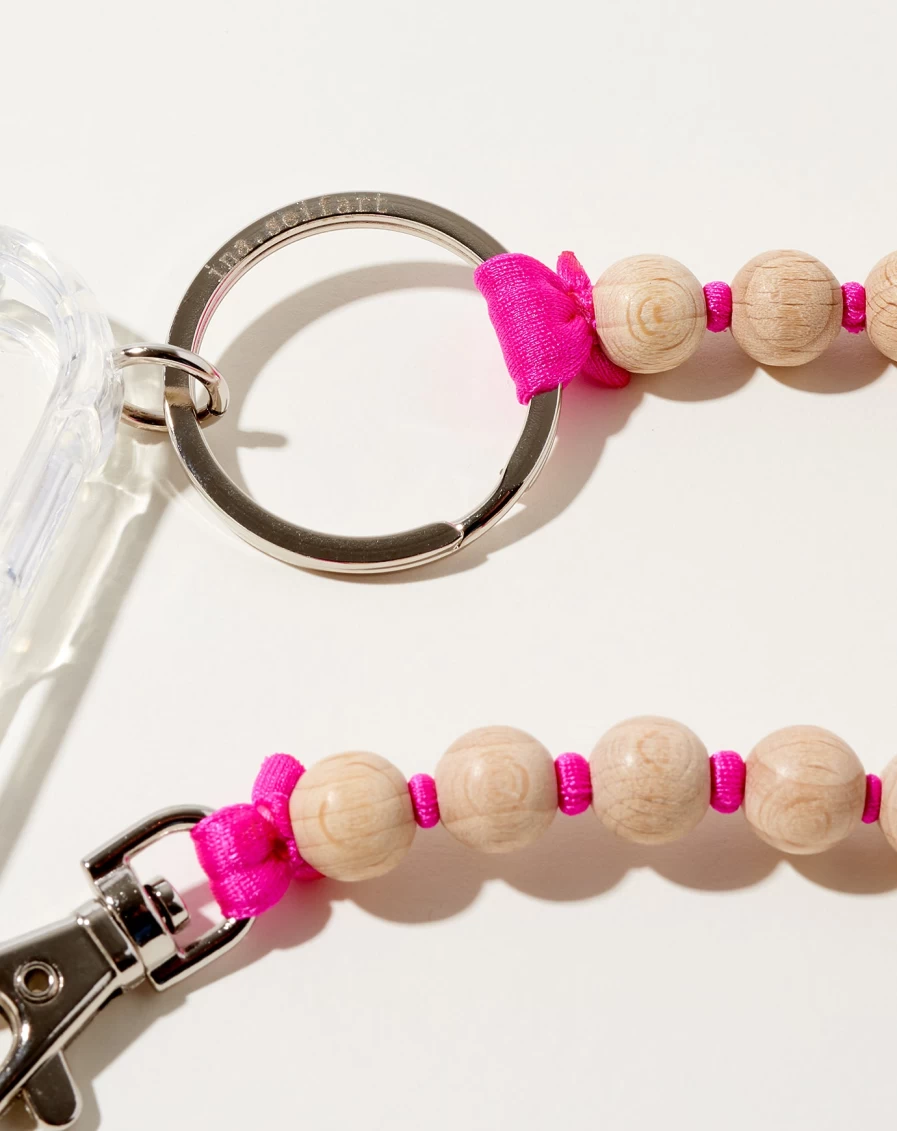 "Ina Seifart iPhone Necklace – Natural Pink Hand Chain for Smartphone"